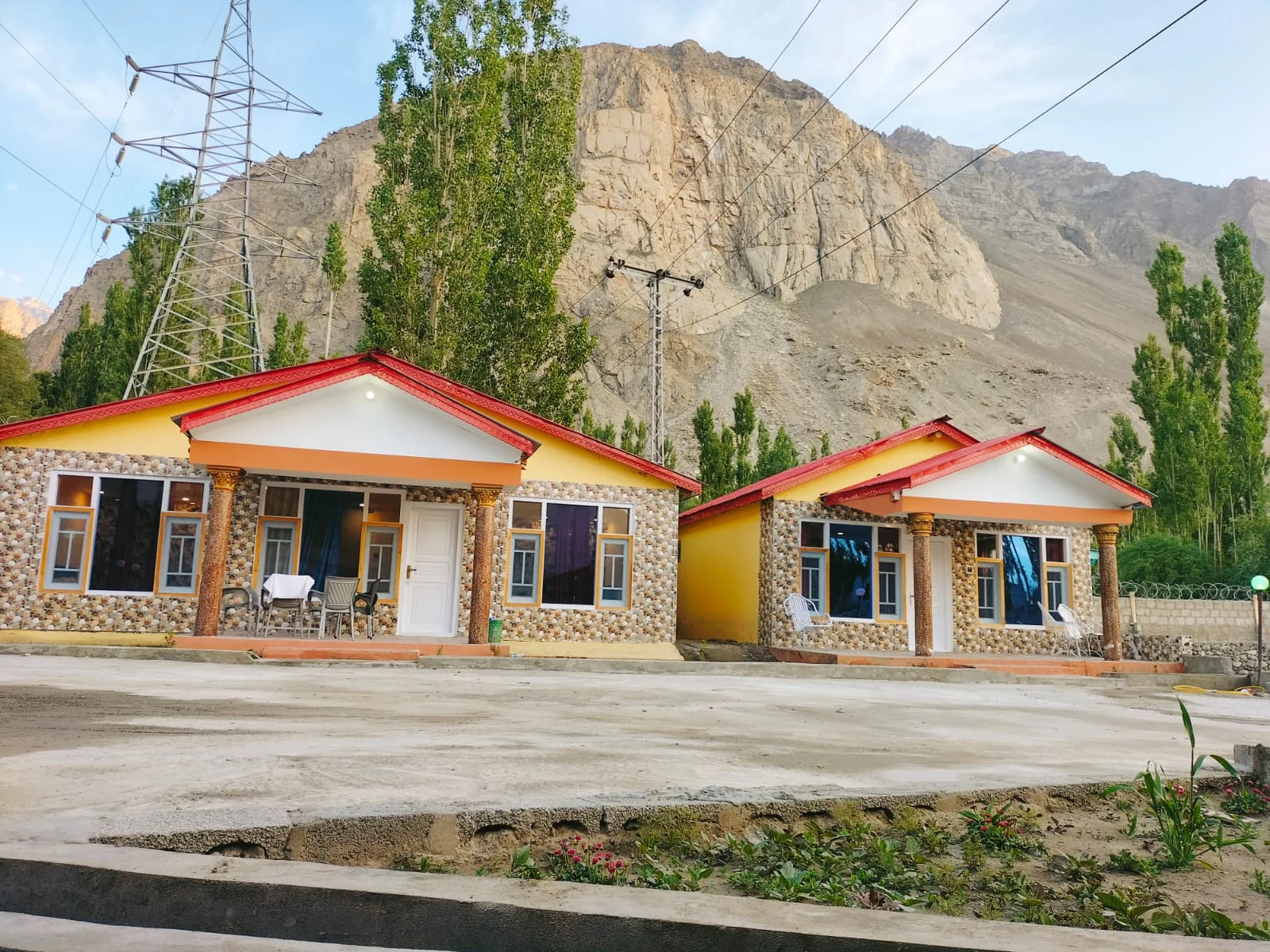Hotel cottages with mountains behind